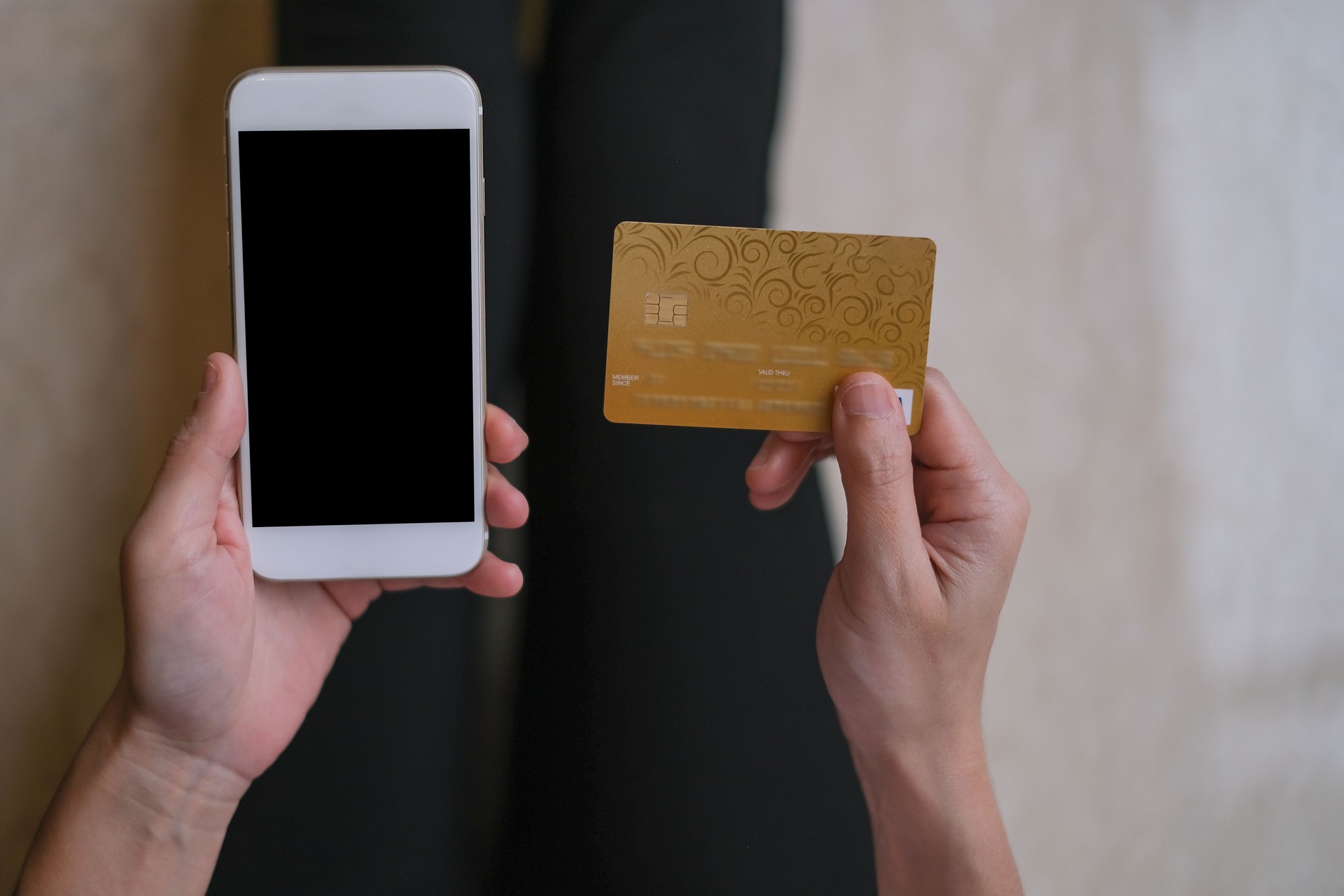 Unrecognizable woman shopping online with credit card